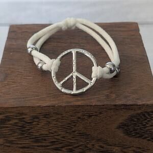 Off White Stretch Cords with Silver Tone Peace Charm Stretch Bracelet